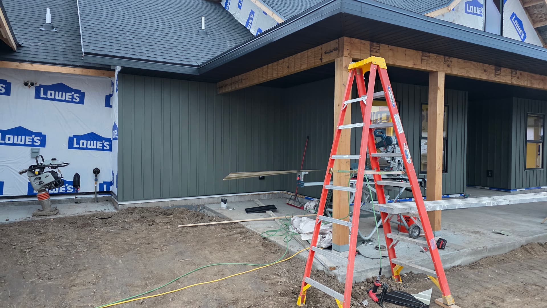 Dark Green Siding and Modern Interiors with Edson Builders
