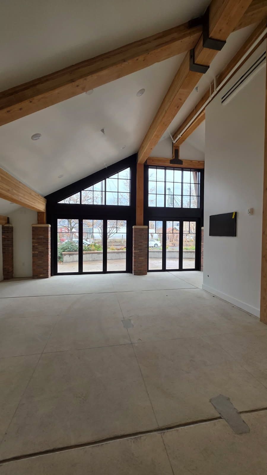 Modern Industrial Interior with Exposed Beams and Ductwork